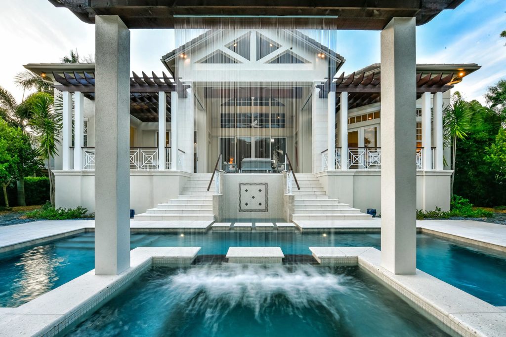 Luxury custom home in Sarasota FL Luxury custom home in Sarasota FL with pool water feature and British West Indies architecture by Nutter Custom Construction